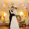 Hanging lanterns light the dance floor during the couple's first dance